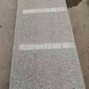 东营芝麻白光面毛板